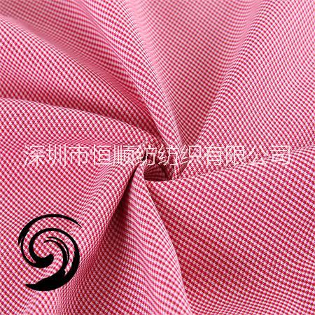 廠家現(xiàn)貨黑色梭織環(huán)?？拱欀窭w維紡織襯衫服裝色織布料T26-1252