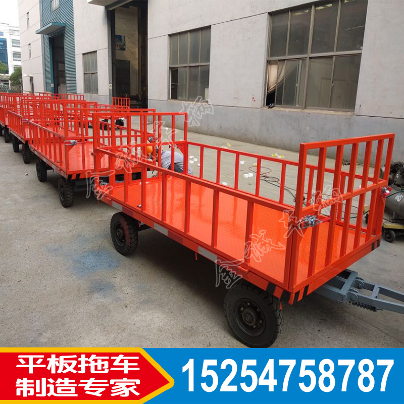廠區(qū)圍欄式平板拖車 場(chǎng)內(nèi)周轉(zhuǎn)貨物帶轉(zhuǎn)向的平板車山東廠家非標(biāo)定制